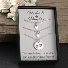 "A Beautiful sterling silver heart necklace set for mother and daughters. Two necklaces come with a tiny heart that fits perfectly inside of the larger heart cut-out circle necklace. This comes with a 14\", 16\", 18\", or 20\" sterling silver flat cable chain. Please convo me for a quote on a longer chain. To add birthstones to this set, you can choose from one of these listings: https://www.etsy.com/shop/DivineJewelrybyMary?section_id=15353062&ref=shopsection_leftnav_4 I also have a tiny in Hypoallergenic Necklace Gift For Mother's Day, Hypoallergenic Necklace For Mother's Day Gift, Hypoallergenic Sterling Silver Necklace For Mother's Day, Hypoallergenic Sterling Silver Necklaces For Mother's Day, Double Heart Charm Necklaces For Wedding And Mother's Day, Dainty Silver Charm Necklace For Mom, Hypoallergenic Necklaces For Mother's Day, Heart-shaped Hypoallergenic Jewelry For Mom, Hypoallergenic Heart-shaped Jewelry Gift For Mom