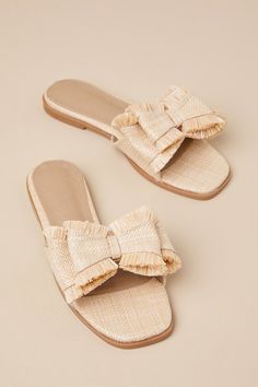 Step into the Castiel Natural Woven Raffia Bow Slide Sandals for an effortlessly chic day strolling through the sunshine! These beachy sandals have a woven raffia construction that shape a squared footbed and a wide vamp strap adorned with a chic, oversized bow-inspired detail. Simple slide-on design makes for easy styling on those leisurely vacay days! 0. 5" rubber heel. Lightly cushioned insole. Rubber sole has nonskid markings. Man made materials. Imported. Lulus | Castiel Natural Woven Raffi Chic Straw Sandals For Summer Outings, Feminine Beige Sandals For Beach, Beige Feminine Beach Sandals, Elegant Sandals For Summer Vacation, Chic Woven Sandals For Summer Outings, Flat Sandals For Summer, Elegant Beige Straw Sandals, Summer Beach Sandals With Textured Footbed, Chic Straw Sandals For Beach Season