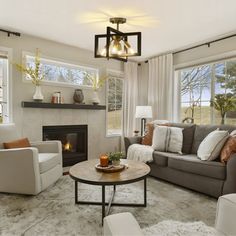 a living room filled with furniture and a fire place