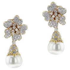 A pair of Pearl and Diamond Day and Night Earrings made in 18k Yellow Gold. The Diamonds are G color, VS clarity, appx. 4.50 carats. The total weight of the earring is 23.17 grams and the length is 1.75." The size of the pearls are 13.8MM. The night earrings is with the dangling pearl, and the day earrings are without the pearl, which can be detached easily. SKU: 1485 Luxury White Clip-on Diamond Earrings, Luxury Pear-shaped Diamond Earrings For Evening, Luxury Pear-shaped Earrings For Evening, Luxury Pear-shaped Brilliant Cut Earrings, High Luster Diamond Earrings For Formal Occasions, Fine Jewelry Earrings With High Luster For Evening, Exquisite High Luster Earrings For Anniversary, Exquisite High Luster Earrings For Formal Occasions, Luxury High Luster Earrings For Anniversary