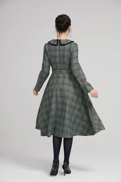 "Simple. With its pleated skirt and grayscale plaid pattern, this vintage wool dress epitomizes classic styling. She's all class and quality with no bells or whistles. Near-perfect vintage condition, designed with lapel collar, long sleeves and tie belt waist, it will be your favorite one of your wardrobe. Details: * 35% wool blend, 35% fiber and polyester, 30% nylon * Polyester lining * long sleeves * tie belt waist * lapel collar * button decoration in front * knee length * back zipper closure Classic Long Sleeve Tweed Dress For Winter, Classic Knee-length Tweed Dress For Winter, Classic Fall Vintage Dress For Workwear, Classic Vintage Dress For Fall Workwear, Vintage Plaid Dress For Winter, Classic Vintage Dress For Work In Fall, Vintage Plaid Winter Dress, Elegant Plaid Midi Dress For Fall, Elegant Fall Plaid Midi Dress