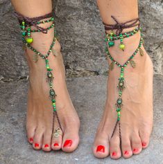 This listing is for a PAIR of barefoot sandals and ONE toe ring. The green leather sandals (picture 3 and 5) are also available in my shop Beautiful and unique barefoot sandals with a ethnic vibration. They look great as necklace or on the hands too :) Handmade crochet with love and care using waxed polyester cord, antique bronze hamsa hands connectors and charms, glass beads and brass beads. The lace is long enough to wrap it 2 times around the leg. Each end of the string is closed with glass b Bohemian Toe Post Sandals For Beach Season, Adjustable Single Toe Strap Barefoot Sandals For Vacation, Adjustable Barefoot Sandals With Single Toe Strap For Vacation, Green Bohemian Open Toe Sandals, Adjustable Barefoot Sandals For Vacation, Hippie Jewelry For Beach Festivals, Handmade Open Toe Barefoot Sandals As Gift, Handmade Open Toe Barefoot Sandals For Gift, Green Handmade Bohemian Sandals