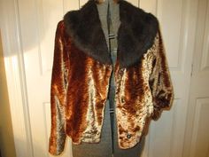 "Late 70's early 80's I think. 100% polyester. Dry clean. Soft textured velvet in dark or antique gold with a brown faux fur collar. Snap front closure. Front pockets. Marked size L. It measures 20\" long. 16 1/2\" across the back of the shoulders. 23 1/2\" sleeves. Laying flat seam to seam it's 21\" across under the arms. Very nice condition. The lining is pulled a little at the back shoulder blade seams (last photo). I ship same or next business day." Fall Party Outerwear In Mink Color, Brown Winter Evening Outerwear, Vintage Brown Outerwear For Costume, Vintage Gold Outerwear For Fall, Retro Winter Party Outerwear, Retro Fitted Brown Fur Coat, Retro Brown Fitted Fur Coat, Retro Fall Costume Outerwear, Mannequin Dress