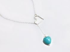 "Turquoise Heart Clasp-less Lariat Necklace Dainty and sweet ~ the small turquoise heart and larger open heart loop are a match made in heaven. The perfect gift for your sweetie! *See important measuring instructions below - A gorgeous and bright turquoise magnesite heart shaped stone measures 10mm - Chain is a shimmery and light 14k gold fill, rose gold fill or 925 sterling chain - Heart pendant is either sterling silver, rose gold fill or 14k gold fill and measures 15mm - Total length of neckl Turquoise Lariat Necklace Gift, Turquoise Lariat Necklace As A Gift, Sterling Silver Lariat Turquoise Necklace Gift, Adjustable Turquoise Heart Pendant Jewelry, Turquoise Heart-shaped Wedding Jewelry, Turquoise Heart Wedding Jewelry, Handmade Turquoise Lariat Necklace Gift, Turquoise Heart Necklace, Small Heart Necklace