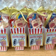 small popcorn boxes are lined up on a table