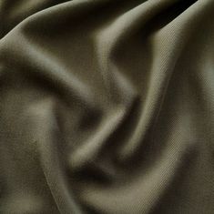 a close up view of a green fabric