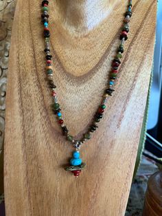 This pretty piece is created with brown jasper, carnelians, red coral, yellow/gold jasper, jade, green garnets and turquoise, all the delicious hues of Autumn. The pendant is a 1.25 inch stack of red Spiny Oyster Shell, Blue Turquoise and green/Brown Turquoise. All the silver accents are .998 fine Thai Silver and.925 Sterling Silver. Sterling paperclip chain, leaves and lobster clasp.  Cynthia Moon is known for intricate detail and little surprises. The .998 fine Thai silver loop and beads all h Brown Jasper, Fall Palette, Sundance Style, Green Garnet, Spiny Oyster, Autumn Colors, Oyster Shell, Style Necklace, Silver Accents