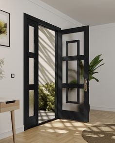 an open door in a room with a potted plant on the floor and sunlight coming through it