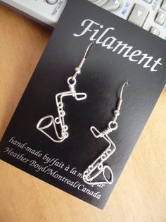 Saxophone Earrings by HeatherBoydWire on Etsy, $14.00 Silver Music-themed Metal Jewelry, Music-themed Silver Metal Jewelry, Gift Metal Hoop Earrings Wire Wrapped, Wire Wrapped Metal Hoop Earrings As Gift, Silver Nickel-free Music-themed Earrings, Nickel-free Metal Music-themed Jewelry, Nickel-free Music-themed Metal Jewelry, Artsy Nickel-free Hoop Earrings As Gift, Music-themed Metal Jewelry For Gifts