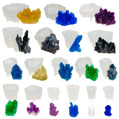 many different colored rocks and crystals on a white background