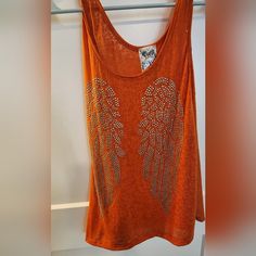 Vocal Flowy Burnout Tank W Stud Angel Wings Details. Size Small. Nwot Trendy Orange Cotton Tank Top, Trendy Orange Beach Tops, Orange Tank Top For Summer Beach Days, Orange Cotton Festival Top, Orange Tank Top For Beach And Summer, Orange Summer Beach Tank Top, Orange Tank Top For Beach In Summer, Casual Orange Tank Top For Beach, Casual Orange Tank Top For The Beach