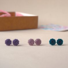 A mat ✨ set of small beaded earrings that can be worn every day. The set includes the following colors: - purple; - dusty pink; - dark green. The earrings are made of miniature Japanese beads. The metal base is stainless steel. The approximate diameter of one earring is 7-8 mm (0.27-0.31 in). A wonderful gift for any event to a wife, sister, friend💕 Please note❗️ The color rendering of the product may differ due to different settings of the displays. Handmade Minimalist Purple Earrings, Hypoallergenic Purple Beaded Earrings, Purple Earrings With Tiny Beads For Gift, Small Beaded Earrings, Violet Rose, Japanese Beads, Colors Purple, Pink Dark, Color Rendering