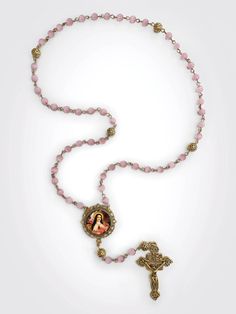 "Features gold-toned crucifix, St. Therese centerpiece, 6mm pink Cat's Eye \"Hail Mary\" beads, and 8mm, gold-toned \"Our Father\" beads." Pink 8mm Beads Crucifix Jewelry, Flower Rosary, Saint Therese, St Therese, Our Father, Hail Mary, Rosary Beads, Pink Cat, Rosary