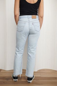 An amazing pair of lived in light wash Levi’s 501 Jeans with the perfect distressing on front legs and left belt loop. 100% Cotton. Features frayed hem and button fly closure. Waist: 30” - Hips: 40” - Rise: 11” - Inseam: 28.5” - Leg Opening: 8" Classic Light Wash Pants For Spring, Light Wash Straight Leg Bottoms With Belt Loops, Levi's Light Wash Relaxed Fit Jeans, Classic Light Wash Relaxed Fit Bottoms, Faded Bottoms With Standard Cut Leg For Spring, Spring Faded Bottoms With Standard Cut Leg, Light Wash Straight Leg Pants With Belt Loops, Classic Light Wash Bottoms For Spring, Levi's Medium Wash Straight Hem Bottoms