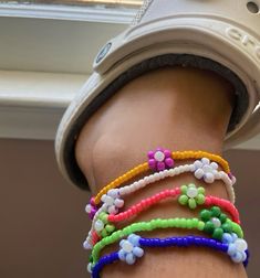 Add a pop of color to your summer look with these handmade beaded floral anklets. Perfect for beach outings and boho outfits, available in multiple sizes to fit any size.  All anklets are handmade! 🌿 Care 🌿 Avoid water, try and keep your anklet as dry as possible as discoloration may occur. Reminder the charm is elastic. In the event your anklet may become dirty use a damp cloth/paper towel to clean and then promptly dry. SAVE EXTRA! Save $15 by purchasing the 5 pack set of anklets. 🌿 Material 🌿 - Seed beads (8/0 and 6/0) - Elastic string Made to order 🌼 Summer Beach Accessories, Summer Accessories Beach, Cloth Paper Towels, Handmade Boho Jewelry, Jewelry Summer, Beach Accessories, Anklet Jewelry, Body Jewellery, Handmade Boho