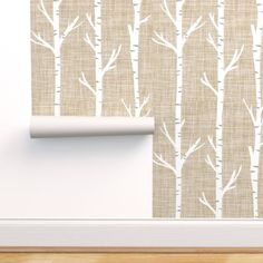 the wallpaper is decorated with white birch trees on beige fabric, along with a wooden floor