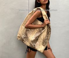 New Handmade Snakeskin Hobo Bag Made of genuine Python leather high quality Color: beige with black pattern  Interior: ecosuede lining Magnet top closure One inner zip pocket and two inner open pockets for phone and cosmetic Size:  52 x 45 cm The colors may vary slightly due angle, lighting, and variation from different computer screens This unique handbag was created with the leather lover in mind and the style & design leaves nothing to be desired. If you have any questions, feel free to email me Snake Print Shoulder Bag For Everyday Use, Everyday Use Snake Print Shoulder Bag, Everyday Snake Print Shoulder Bag, Pattern Interior, Python Bags, Unique Handbag, Snakeskin Purse, Oversized Bag, Beige Bag