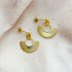 "This  boho sun  EARRINGS has sparkly gold charms reminding  Actec sun . Lovely hint of gold will be wonderful to be given as a gift for Best Friend or will fit your everyday wear. This Rising Sun  inca earrings has  Geometric Modern shape. ♡ DETAILS  CHARMS : approx. 0.78 \" (2 cm) Material: gold plated 925 Sterling Silver, ♡ BUYING AS A GIFT? Each item is  perfectly wrapped for gift giving or as a wonderful present for you! All items come packaged in a jewelry gift box. All orders have a littl Bohemian 14k Gold-filled Earrings, 14k Gold-filled Bohemian Earrings, Gold 14k Bohemian Earrings, Elegant Sunburst Earrings As A Gift, Gold Sunburst Earrings With Sun Design, Gold Celestial Earrings With Sun And Moon Design, Celestial 14k Gold-filled Earrings, Gold Celestial Sunburst Jewelry, Elegant Brass Jewelry With Sun Design