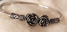 A Rose Design Cuff Silver Adjustable Bracelet Adjustable Flower Jewelry With Roses, Adjustable Flower Shaped Rose Jewelry, Elegant Silver Bracelets With Rose Design, Elegant Silver Bracelet With Rose Design, Adjustable Silver Jewelry With Rose Details, Silver Bracelet With Rose Design For Gift, Silver Bracelets With Rose Design For Gift, Adjustable Silver Flower Bangle, Vintage Silver Jewelry With Roses