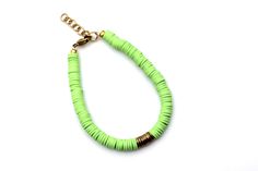 A lime green heishi bead bracelet is the perfect on-trend accessory to top off your look. It is a great stand alone bracelet and works well as a stack bracelet, too. This non-stretch bracelet features lime green polymer clay heishi beads with gold brushed metal beads in the center, all hand-strung onto flexible jewelry wire. The bracelet is finished off with a lobster clasp, and a 1" extender chain to accommodate various wrist sizes. MATERIALS Polymer Clay & Metal Beads SIZE 6 1/2" Extendable Up Lime Green Bracelet Jewelry For Gift, Elegant Lime Green Beaded Jewelry, Handmade Lime Green Bohemian Jewelry, Lime Green Jewelry, Lime Green Bracelet, Heishi Beads, Brushed Metal, Bracelet Stack, Metal Beads