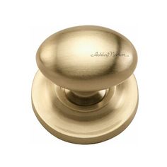 an antique brass cabinet door knob