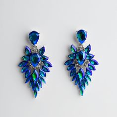 Be The Talk Of The Town With Our Just Girl Stuff Earrings #5010! These Bold Pear Shaped Earrings Feature Blue Multicolor Gems And Silver Gemstone Accents, Adding A Pop Of Color And Sparkle To Any Outfit. Perfect For The Girl Who Loves To Stand Out And Have Fun! Just Girl, Talk Of The Town, The Talk, Girl Stuff, Just Girl Things, The Girl Who, Pear Shaped, Have Fun, Pear