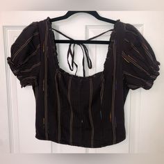 “Espresso Bean” Colored Free People Cropped Puff Short Sleeve Blouse. Scooped Square Neck In Front And Back. Back Has String Tie Detail Between Shoulders. Sinched/Elastic/Corset Style Back For More Fitting Body. Made Of 98% Cotton 2% Polyester. Size Small. Feel Free To Ask Questions Or Make Me An Offer! Satin Tie Front Top, Fringe Blouse, Babydoll Shirt, Big Sleeves, Free People Blouse, Peasant Style, Color Block Top, Henley Top, Flowy Tops