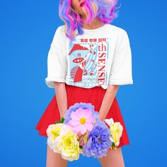 a woman with colorful hair holding flowers in her hand and wearing a t - shirt