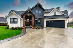 a large house with two car garages in front of it