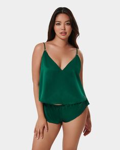 Up your nightwear game with the Faye cami and short set. This charming due showcases a flirty, provocative cut that flatters your shape, while the striking green hue adds a vibrant burst of colour to your collection, exuding a sense of playfulness and fun. One of the standout features of the Faye set is the subtle BB monogram, perfect for all true Bluebella fans. Bb Monogram, Thigh Harness, Thigh Chain, Chiffon Kimono, Satin Cami, Soft Cup Bra, Neck Chain, Short Set, Bra Cups