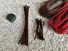 there are many different colored cords on the floor