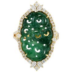 This beautiful ring is cast in 18 Karat gold. It is hand set in 5.93 carats Jade and 1.05 carats of sparkling diamonds. FOLLOW MEGHNA JEWELS storefront to view the latest collection & exclusive pieces. Meghna Jewels is proudly rated as a Top Seller on 1stDibs with 5 star customer reviews. All items manufactured by us are handmade and can be customized or redesigned. Composition Size-US-7 Total Weight-7.236 Gold Weight(Gms)-5.841 Diamond Wt(Cts)-1.05 Jade Wt(Cts)-5.93 Carved Jade, Jade Ring, 18k Yellow Gold Ring, Jade Carving, Mens Jewelry Bracelet, Yellow Gold Ring, Gold Diamond Rings, Sparkle Diamonds, Heart Jewelry