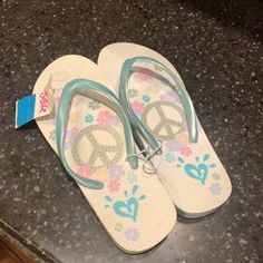 New With Tags. Peace Sign And 60s Flowers 60s Flowers, Purple Wedges, Justice Shoes, Glitter Flip Flops, Sparkle Sandals, Sparkly Sandals, Girls Flip Flops, Rainbow Sandals, Slingback Flats