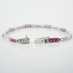 This bracelet is set in 14K Solid White Gold, Studded with Princess-cut Rubies and Round Diamonds; Three rubies alternating with three diamonds. A luxury jewelry gift for your loved ones. -Material - 14K Solid white Gold -Gemstone - Ruby & Diamonds -Gemstone Weight - 3.010 ct -Diamond Weight - 0.450 ct -Gross weight - 10.9 grams The bracelet length can be adjusted to your wrist size, on request. You can also go to my shop Home for more similar bracelets: https://www.etsy.com/in-en/shop/Silve Luxury Jewelry Gift, Bracelet Elegant, Bracelet Tennis, Ruby Bracelet, Birthstone Bracelet, 925 Silver Bracelet, Bracelet Chain, Birthstone Bracelets, Elegant Bracelet