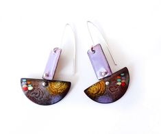 two pairs of earrings that have been made out of metal and painted with different colors