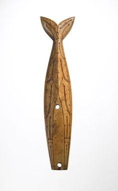 a wooden sculpture with a whale tail sticking out of it's back end, against a white background