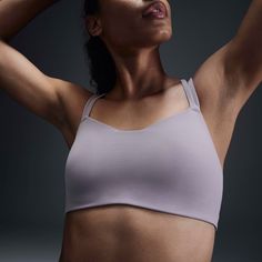 Feel calm and confident all day long in this strappy, gently supportive bra. A sewn-in 1-piece pad offers enhanced coverage and shaping while sweat-wicking technology helps keep you cool and comfortable. The fabric in the body and straps is lightweight, with softness that you can feel with every bend, stretch and shift. With a rounded V-neck to top it off, the bra has a clean finish that goes with any outfit. Fit & Design: Light support gives you a gentle hold with plenty of freedom that's great for low-impact workouts or all-day comfort Nike Dri-FIT technology moves sweat away from your skin for quicker evaporation, helping you stay dry and comfortable Adjustable Straps Sports Bra For Light Exercise, Adjustable 4-way Stretch Sports Bra For Light Exercise, Light Support Sports Bra With Tank Straps For Training, Supportive Strapped Activewear For Pilates, Adjustable Straps Micro-elastic Activewear For Pilates, Supportive Athleisure Sports Bra With Straps, Fitted Workout Bra With Adjustable Straps, Functional Sports Bra With Light Support And Tank Straps, Supportive Sports Bra With Straps For Training