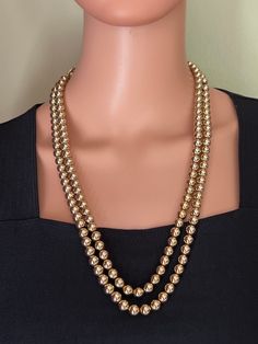 Vintage Long Double Strand Mid Century Gold Bead Layered Necklace 2 strands of gold tone round beads strung on gold tone chain. Matching box clasp in good working condition.  Measures 25 inches long. In excellent vintage condition.  ATTENTION Jewelry Lover Save 15%Today!  Copy and Paste the Link: https://mailchi.mp/6c4f021a85cf/yesterdaysluster To sign up for our email list and receive a code to save 15% on your order. Our Mission: Our mission is to provide unique and beautiful people with uniqu Gold Beaded Pearl Necklace For Formal Occasions, Gold Pearl Necklace With Round Beads For Formal Occasions, Vintage Gold Round Pearl Necklace, Formal Yellow Gold Beaded Necklace, Gold Beaded Necklace For Formal Occasions, Gold Pearl Necklace With Polished Beads For Party, Classic Gold Necklace With 8mm Beads, Classic Gold Pearl Necklace With Round Beads, Elegant Gold Necklaces With 8mm Beads