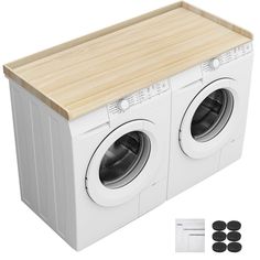 a white washer and dryer sitting next to each other on top of a wooden cutting board