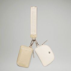 The Uber Popular *Wordmark Dual Pouch Wristlet In Raw Linen/White Opal/White Combo *Goes With Everything!!!* Brand New With Tags Perfect For Sporting Events/Conventions, Concerts/ Festivals!!! *Note: There Are No Card “Slots”, But You Can Easily Fit Up To 11 Cards Per Pouch. The Oval Pouch Is Very Easy To Take Cards In And Out Without Turning/Maneuvering Price Firm- Bundle For Discount! *Stock Photos Courtesy Of Lululemon Athletica Lululemon Wristlet, Lululemon Dual Pouch Wristlet, Lululemon Dual Pouch, Dual Pouch Wristlet, No Card, Lululemon Outfits, Linen White, Opal White, Cute Bags