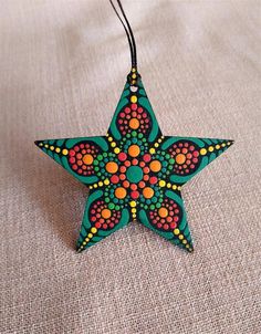 an ornament made out of wood and beads