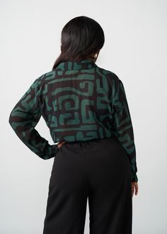 Style#: 5024/P5024 Jazz up your work fit with the Zoela Women's African Print Sheer Blouse in the Black Malachite Geometric print—an African twist to a classic sheer button-up blouse that is sure to add flavor to your wardrobe. Features: Self-lined Buttons at sleeve cuff Pointed collar 100% Polyester​ Sheer, lightweight fabric Designed in the USA, imported Care Instructions: Machine wash cold on gentle cycle with non-chlorine detergent. Hang to dry. Do not bleach. Iron on low. Models: Size: XS H