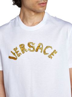 Elevate your casual wardrobe with this luxurious cotton t-shirt featuring a ribbed neckline and exquisite seashell baroque front logo embroidery. Crafted from a blend of 100% cotton, 5% polyester, and 95% viscose, this t-shirt offers both comfort and style for the fashion-forward individual. Whether you're running errands or meeting friends for brunch, this logo embroidery cotton t-shirt is a versatile and sophisticated choice. Indulge in the opulence of designer fashion with this must-have piec Baroque Pattern, Embroidery Cotton, Lettering Logo, Versace Men, Leather Cap, Mens Gloves, Ribbed Neckline, Embroidered Tshirt, Logo Embroidery