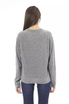 Elevate your wardrobe with a touch of Italian sophistication in this Baldinini Trend sweater. Designed for those who crave chic comfort, it features long sleeves, a classic crew neck, and the iconic Baldinini Trend monogram in elegant metal. Crafted with a premium blend of wool, viscose, cashmere, and nylon, this gray knit offers luxurious softness and warmth while ensuring durability. Perfectly ribbed at the neck, wrists, and bottom hem, it promises a cozy fit and a stylish silhouette with ever Luxury Fine Knit Cashmere Sweatshirt, Luxury Fine Knit Crew Neck Sweatshirt, Luxury Gray Sweater With Ribbed Cuffs, Luxury Sweater With Ribbed Cuffs And Crew Neck, Luxury Gray Cashmere Tops, Luxury Wool Sweatshirt With Ribbed Collar, Luxury Wool Sweatshirt With Ribbed Cuffs, Luxury Knit Crew Neck Sweatshirt, Luxury Wool Long Sleeve Sweatshirt