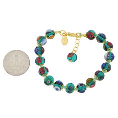 Add a touch of classic Venetian style to your outfit with this elegant Murano millefiori bracelet. Centuries-old Murano glass technique perfected by Italian master craftsmen is used to create colorful mosaic effect that is fun and trendy, yet classic and timeless. This is a unique piece of Venetian jewelry that will brighten up your look and your day. Each Murano Mosaic bracelet measures approximately 7 3/4 inches in length and comes with an attractive velvet pouch and a certificate of authenticity. Because each item is a unique work of art made by hand, slight variations of colors and patterns are possible. Elegant Glass Beaded Bracelets, Elegant Clear Round Beaded Bracelets, Elegant Glass Bracelets With Round Beads, Elegant Multicolor Round Beads Bracelet, Elegant Multicolor Murano Glass Jewelry, Elegant Glass Bracelets For Gifts, Elegant Round Murano Glass Jewelry, Elegant Multicolor Czech Glass Bracelets, Elegant Glass Beaded Bracelets As Gift