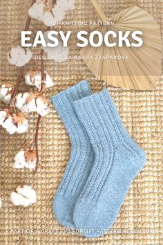 a pair of socks sitting on top of a rug next to cotton