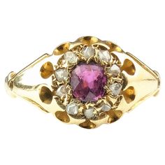 A classic and timeless antique cluster ring is a perfect gifting or engagement ring choice. This gorgeous Edwardian era cluster ring is one of those elegant beauties, it features a lovely pinky red ruby which is surrounded by a halo of rose cut diamonds. All set into rich 18ct yellow gold with chunky shoulders and a slender tapering gold band and a belcher style setting. Looks great stacked with a nice gold band or worn alone. Marks and era: Edwardian era, fully hallmarked for 18ct gold, Birmingham assay office, Date letter rubbed c1900s. Condition: Good used condition overall, minor surface wear, commensurate with age, some light surface wear to the stone, thinning to the back of the band from wear. Ring face Approx 8.9mm length and 1.5mm band width. Central Ruby approx 0.30ct weight, est Classic Pink Cluster Ring For Formal Occasions, Classic Ruby Ring With Rose Cut Diamond Cluster, Victorian Gemstone Cluster Wedding Ring, Victorian Gemstone Cluster Ring For Wedding, Pink Formal Rings With Rose Cut Diamonds, Elegant Pink Cluster Ring With Rose Cut Diamonds, Formal Pink Rings With Rose Cut Diamonds, Elegant Pink Rose Cut Diamond Cluster Ring, Vintage Brilliant Cut Cluster Ruby Ring