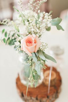 a vase filled with flowers sitting on top of a table