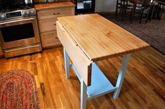 a kitchen with an island made out of wood