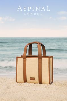 tote bags, beach outfit, vacation outfits, summer outfit Chic Beach Bag With Bamboo Handle For Travel, Light Brown Woven Leather Rectangular Bag, Sand-colored Shoulder Bag With Braided Handles For Travel, Beige Top Handle Straw Bag For Travel, Travel Shoulder Bag With Braided Handles In Sand Color, Travel Bag With Braided Handles In Sand Color, Top Handle Jute Bag With Woven Leather, Luxury Woven Bags For Travel, Sand Bags With Braided Handles For Travel